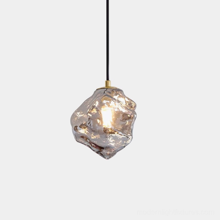 Mirza handcrafted glass pendant light with smoke gray irregular shade and brass hardware, frontal view with minimalist white background