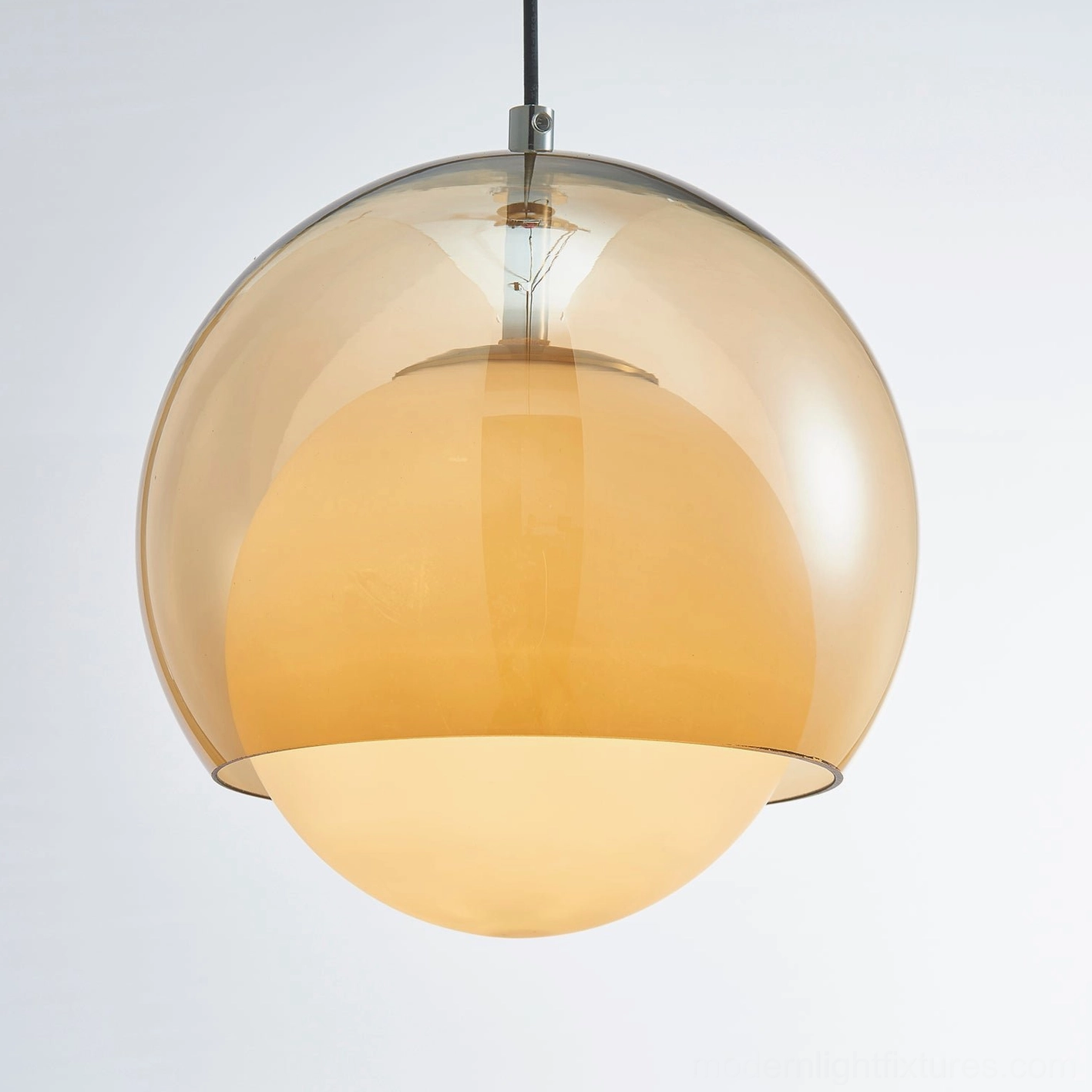 Suspended Misty pendant light with adjustable cord showing installation flexibility and height customization