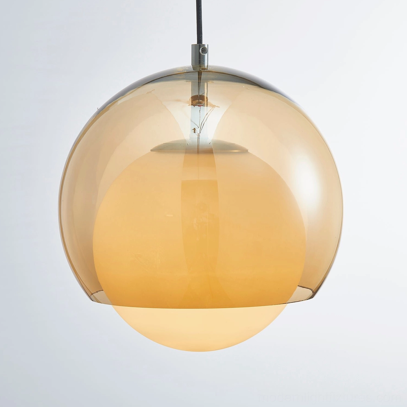 Misty white frosted glass pendant light in minimalist interior creating soft diffused light quality