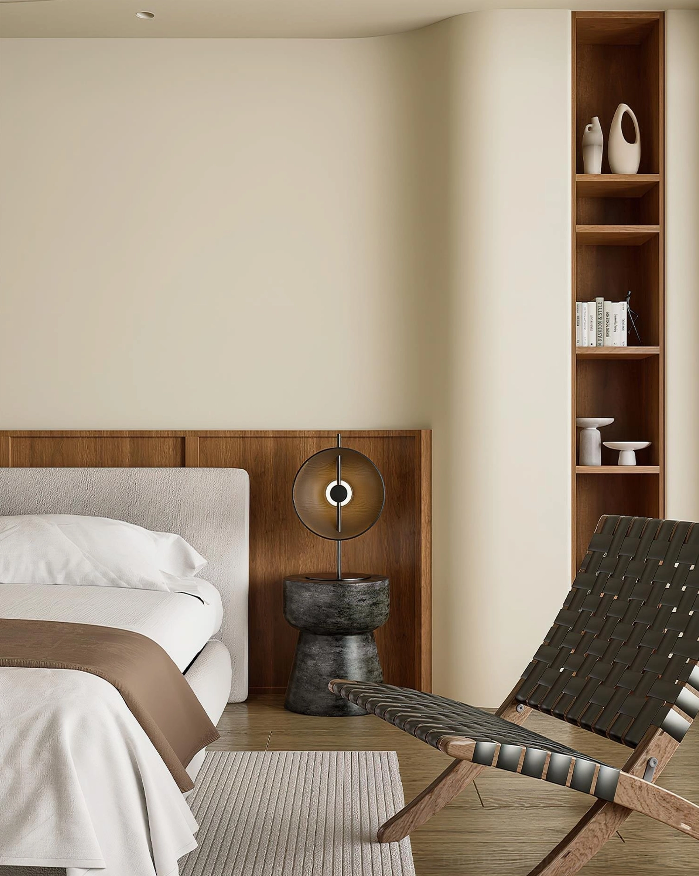 Mito circular table lamp in modern bedroom setting with lounge chair and warm cozy interior lighting atmosphere