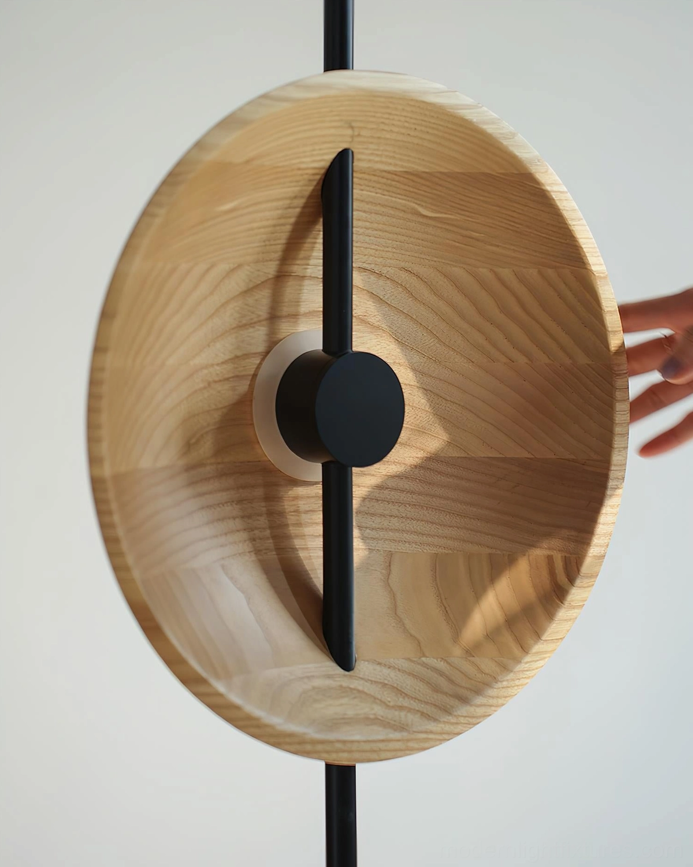 Mito floor lamp single disc shade close-up showing natural wood grain and black metal hardware detail