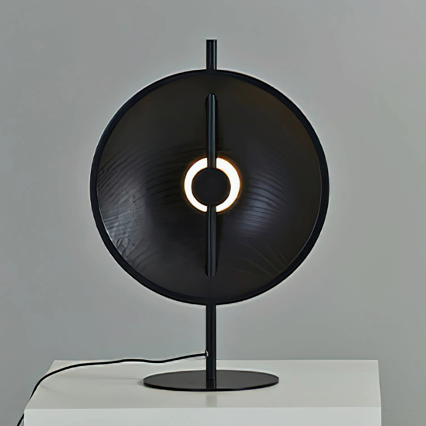 Mito matte black modern circular table lamp featuring refined metal construction and minimalist aesthetic