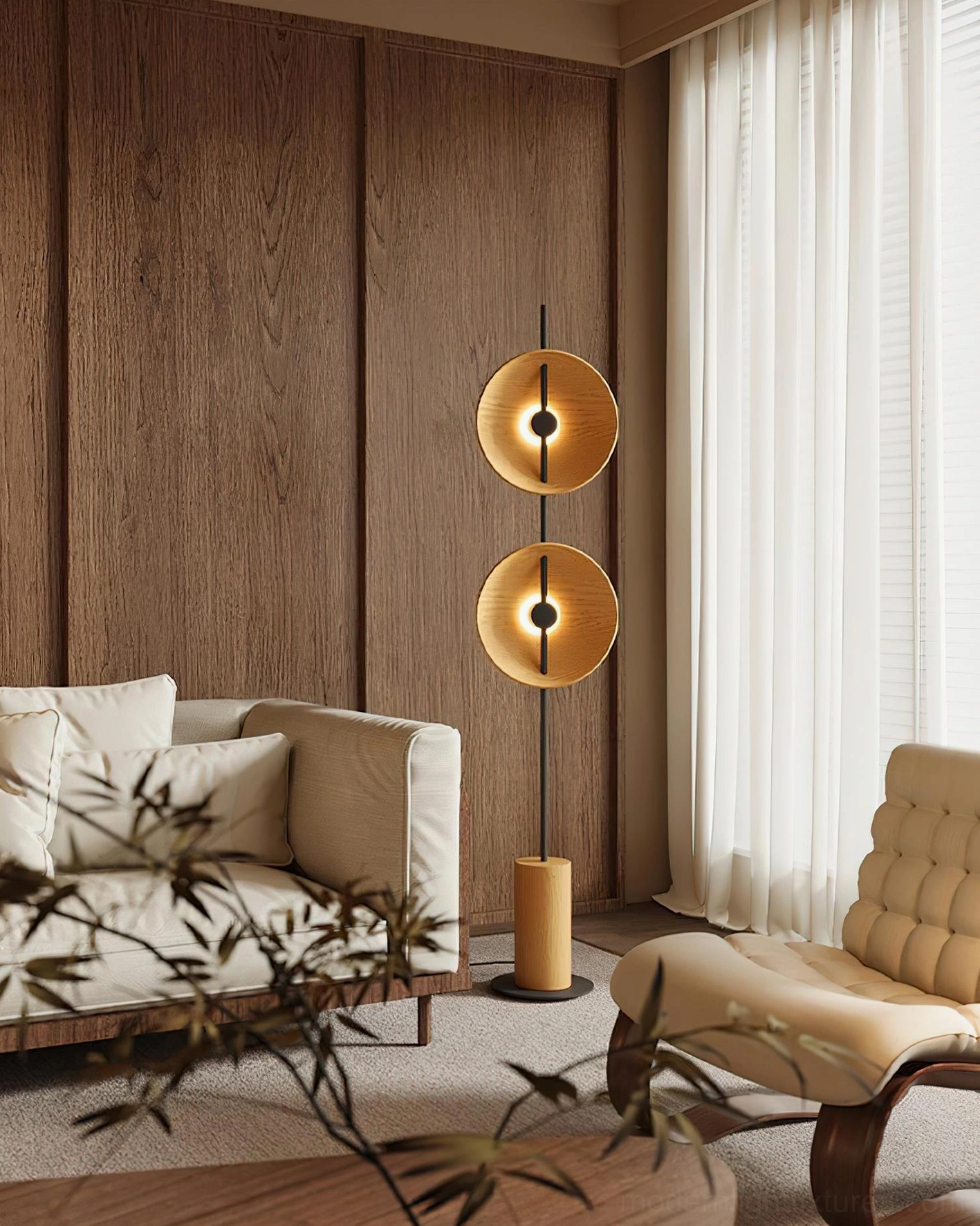 Mito sculptural floor lamp illuminated in contemporary living space with sofa and warm neutral decor