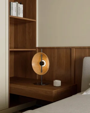 Contemporary wooden disc table lamp on bedroom nightstand with warm 3000K lighting and neutral interior decor