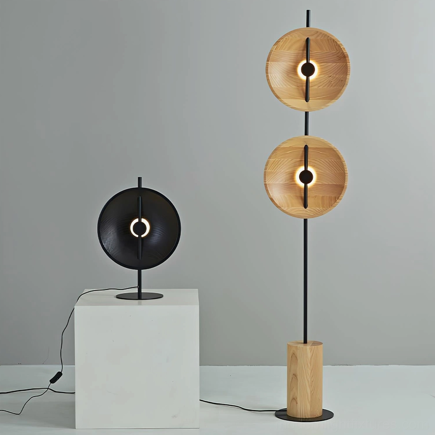 Mito black disc table lamp and dual-disc modern floor lamp comparison displaying product range