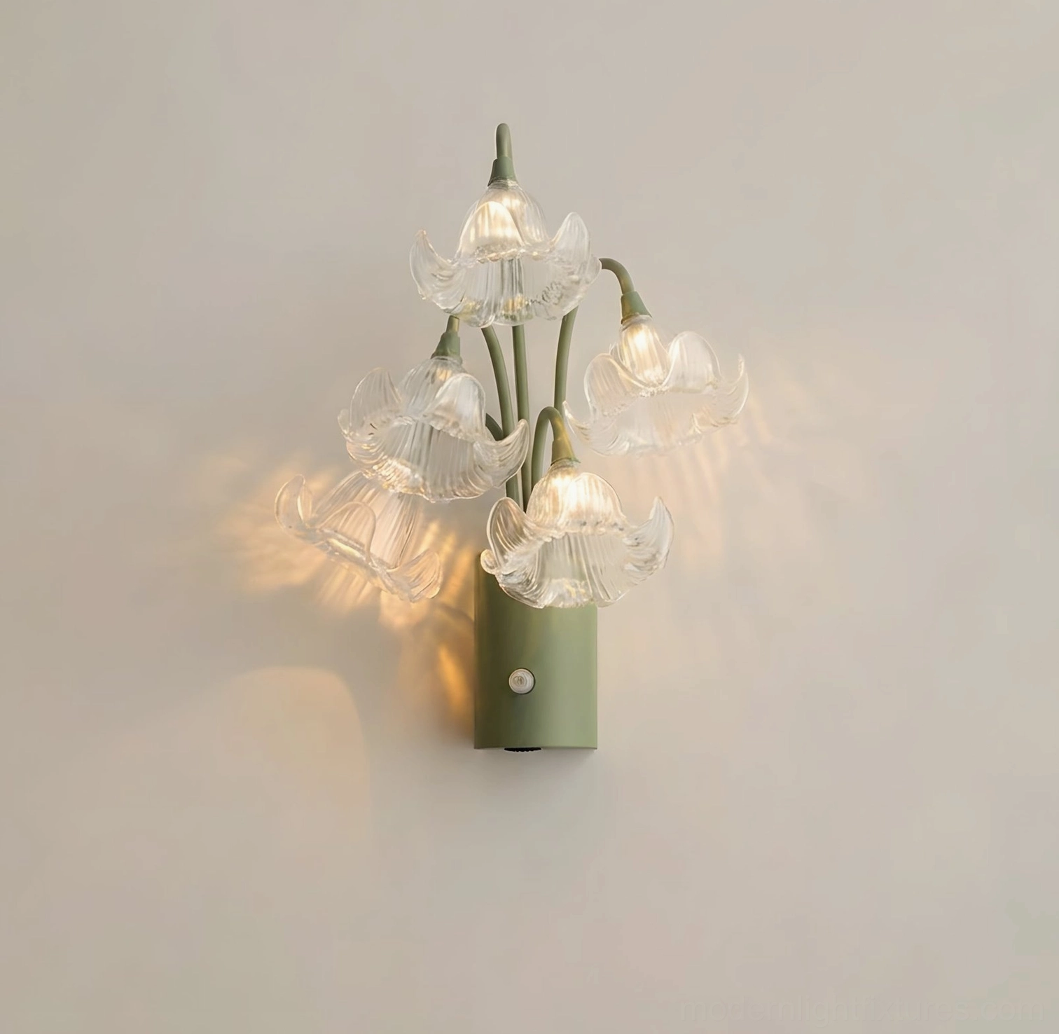 Mivella clear acrylic flower wall sconce showing transparent ribbed glass-like flower shades with green iron stem structure