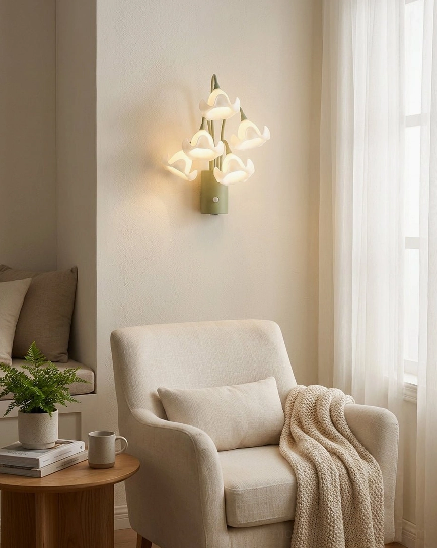 Mivella floral wall sconce in living room beside armchair providing warm accent lighting and ambient glow