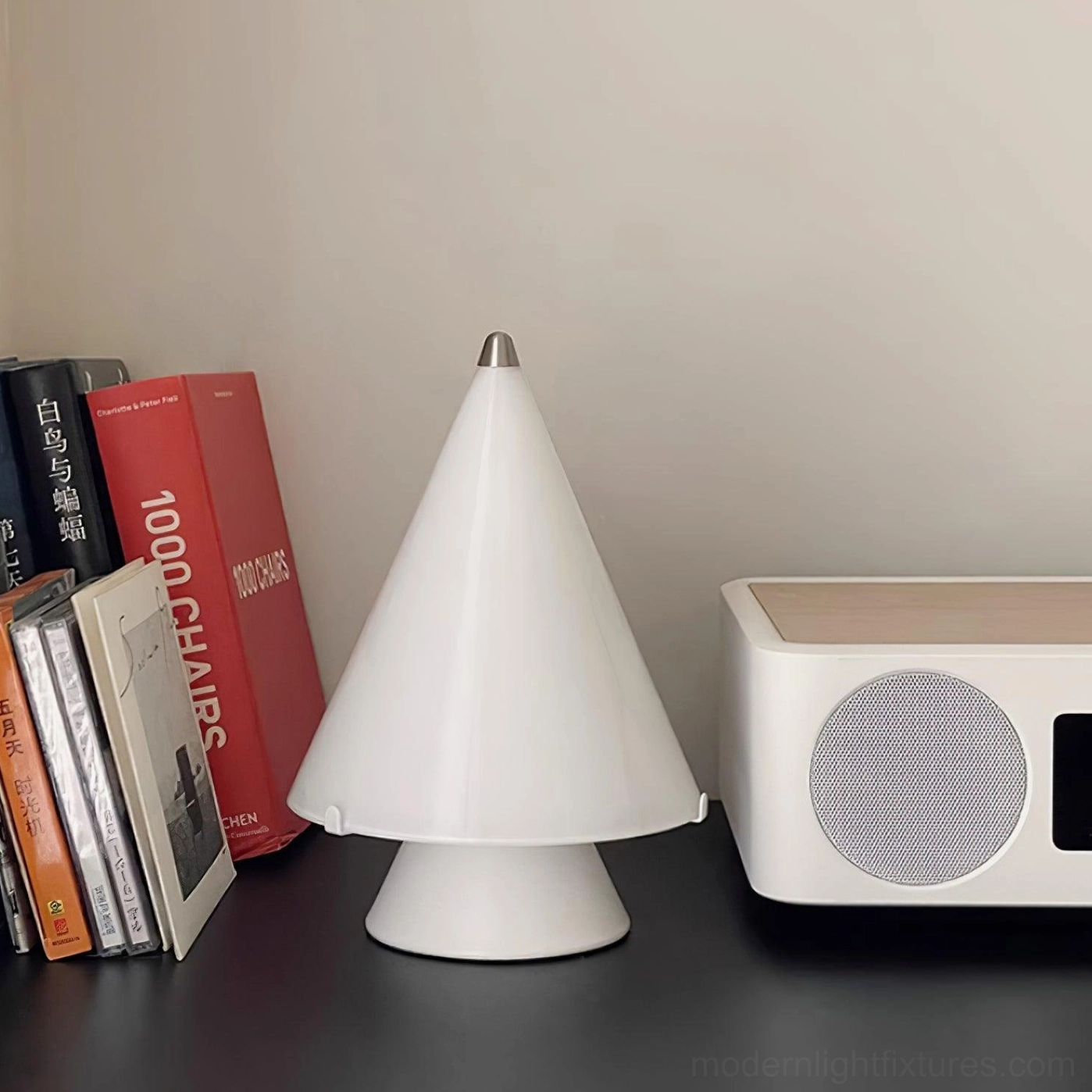 Miza modern table lamp unlit on home study desk with books and desktop speaker setup
