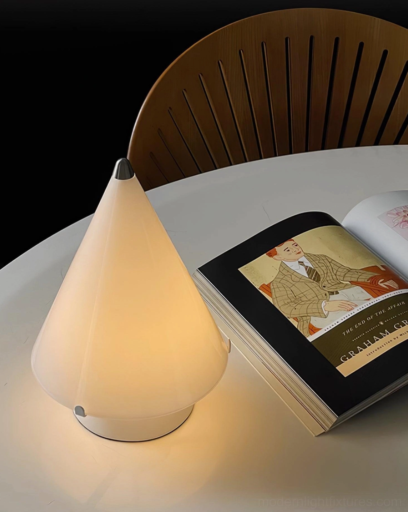 Miza LED table lamp illuminated on round white table in home dining room interior
