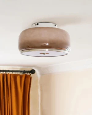 Modern mocha flush mount ceiling lamp installed in bedroom corner with warm ambient lighting