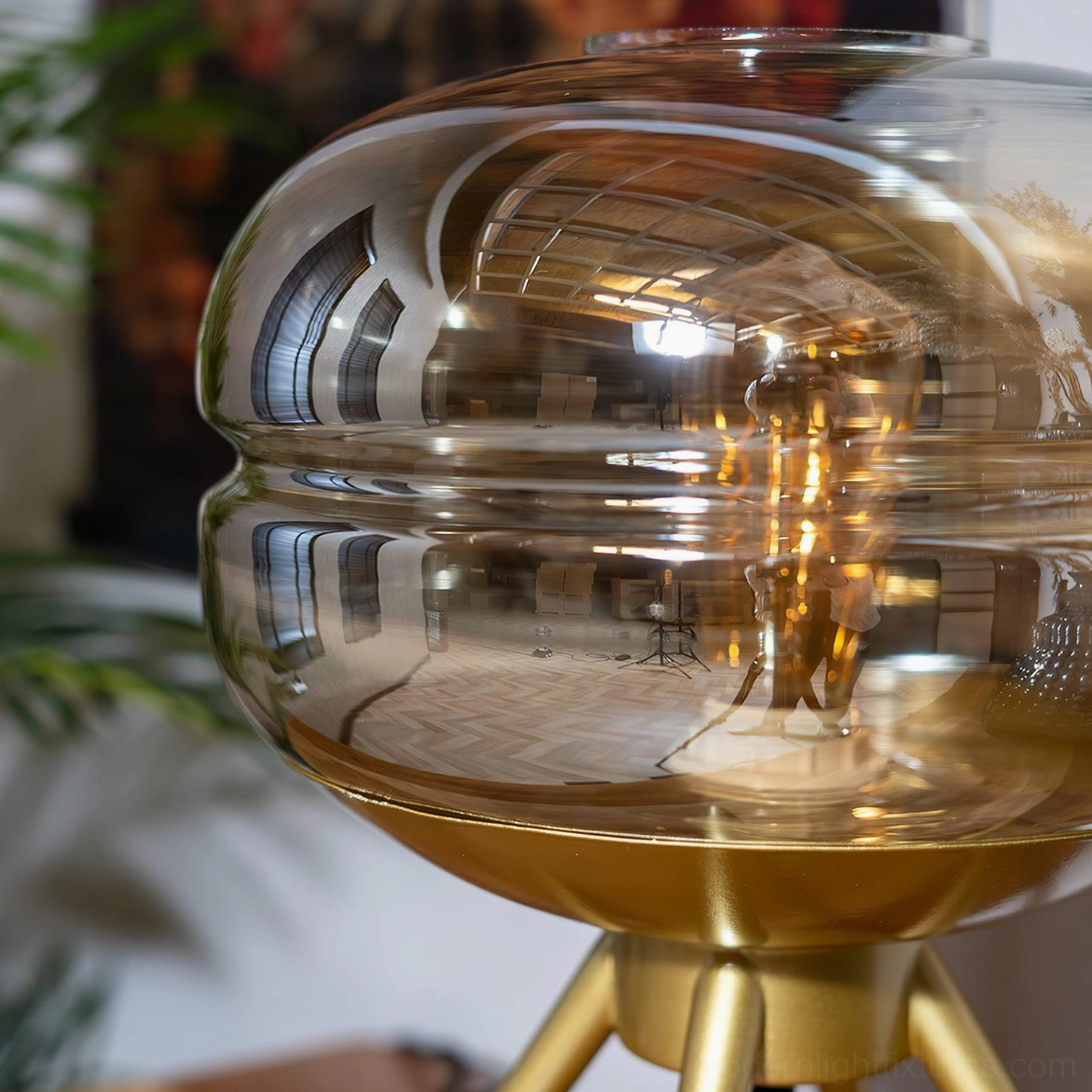Moda tiered glass table lamp showing brass base craftsmanship and weight distribution detail