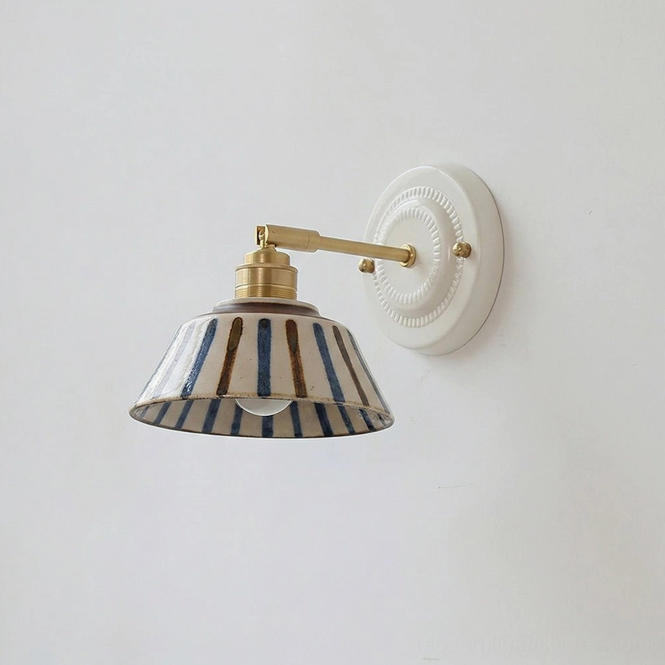Model A handcrafted indigo ceramic wall sconce with traditional floral glaze pattern