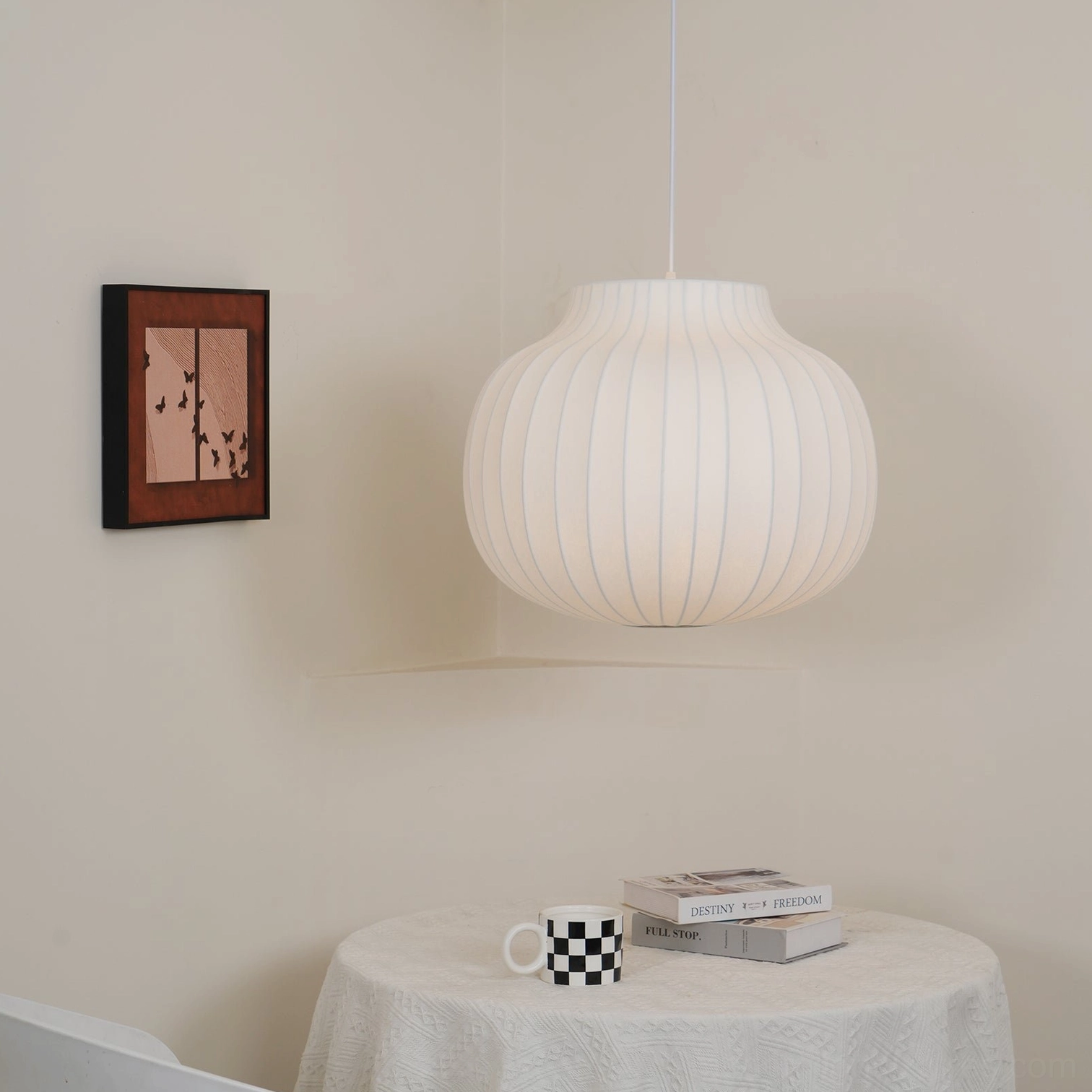 Model B ribbed cocoon pendant light 50cm diameter hanging in modern dining room setting