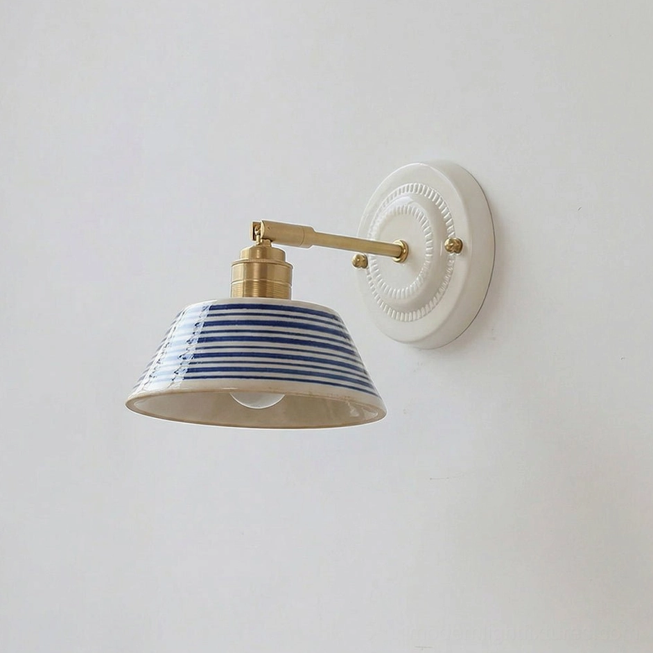 Model E artisan indigo ceramic wall lamp with brass hardware and sculptural white base