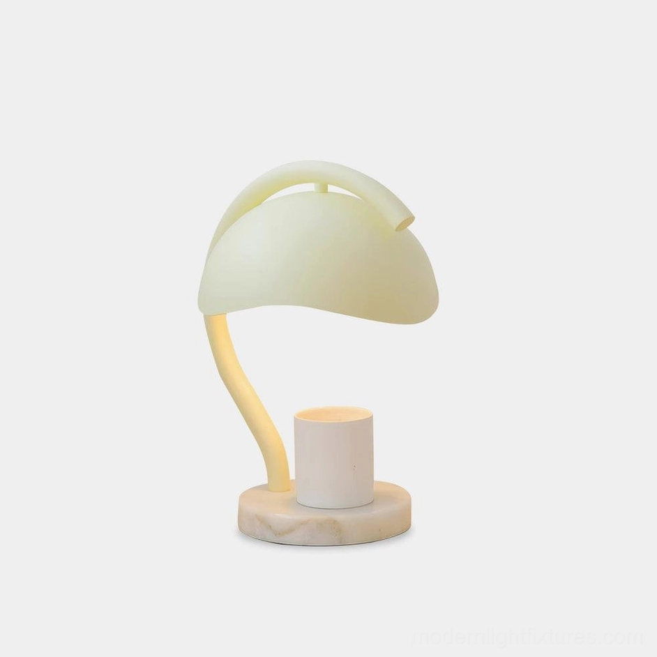 Modern alabaster candle warmer table lamp with white marble base and integrated LED warm lighting on minimalist white studio background
