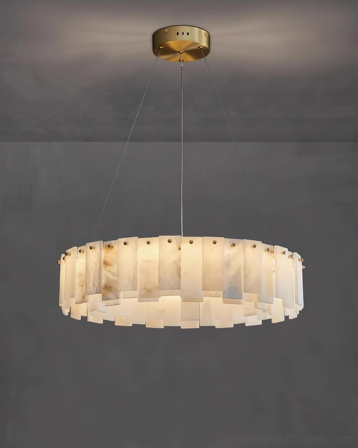 Modern alabaster pendant chandelier creating sculptural focal point, architectural tier arrangement of natural stone rings providing ambient gallery-quality lighting