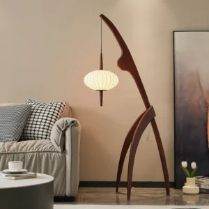 Arc floor lamp with curved wooden stand and minimalist fabric lantern in contemporary living room interior