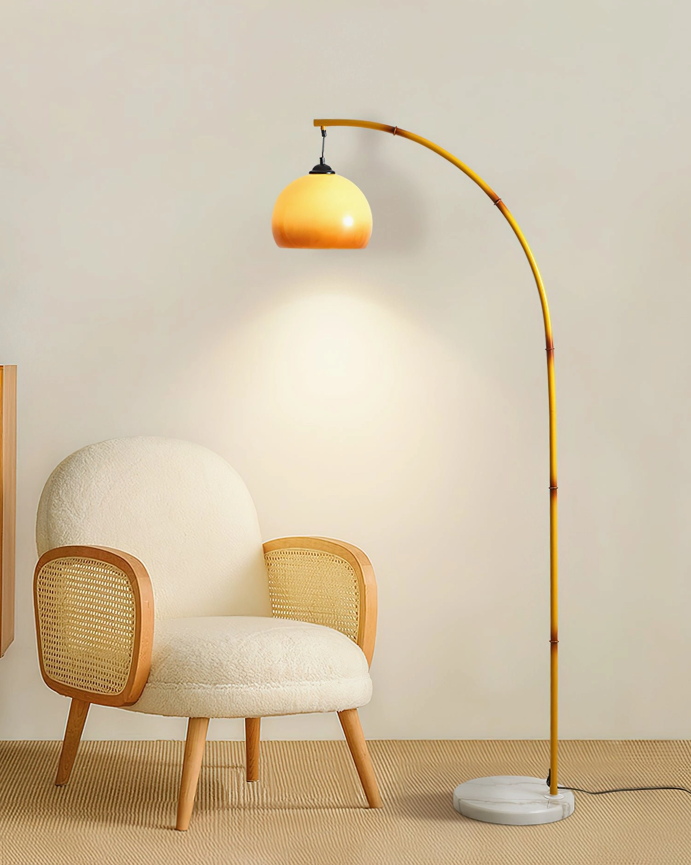Modern yellow arc floor lamp displayed in contemporary living room with rattan chair and natural lighting