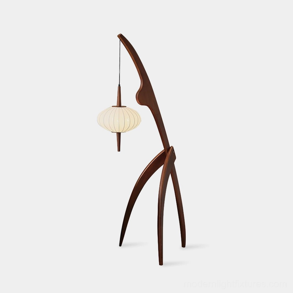 Modern arc floor lamp with dark walnut wooden frame and off-white fabric lantern shade against white studio backdrop