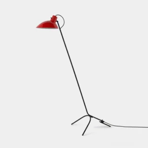 Modern arc tripod floor lamp with red dome shade and black metal pole, three-prong base, studio lighting showcase