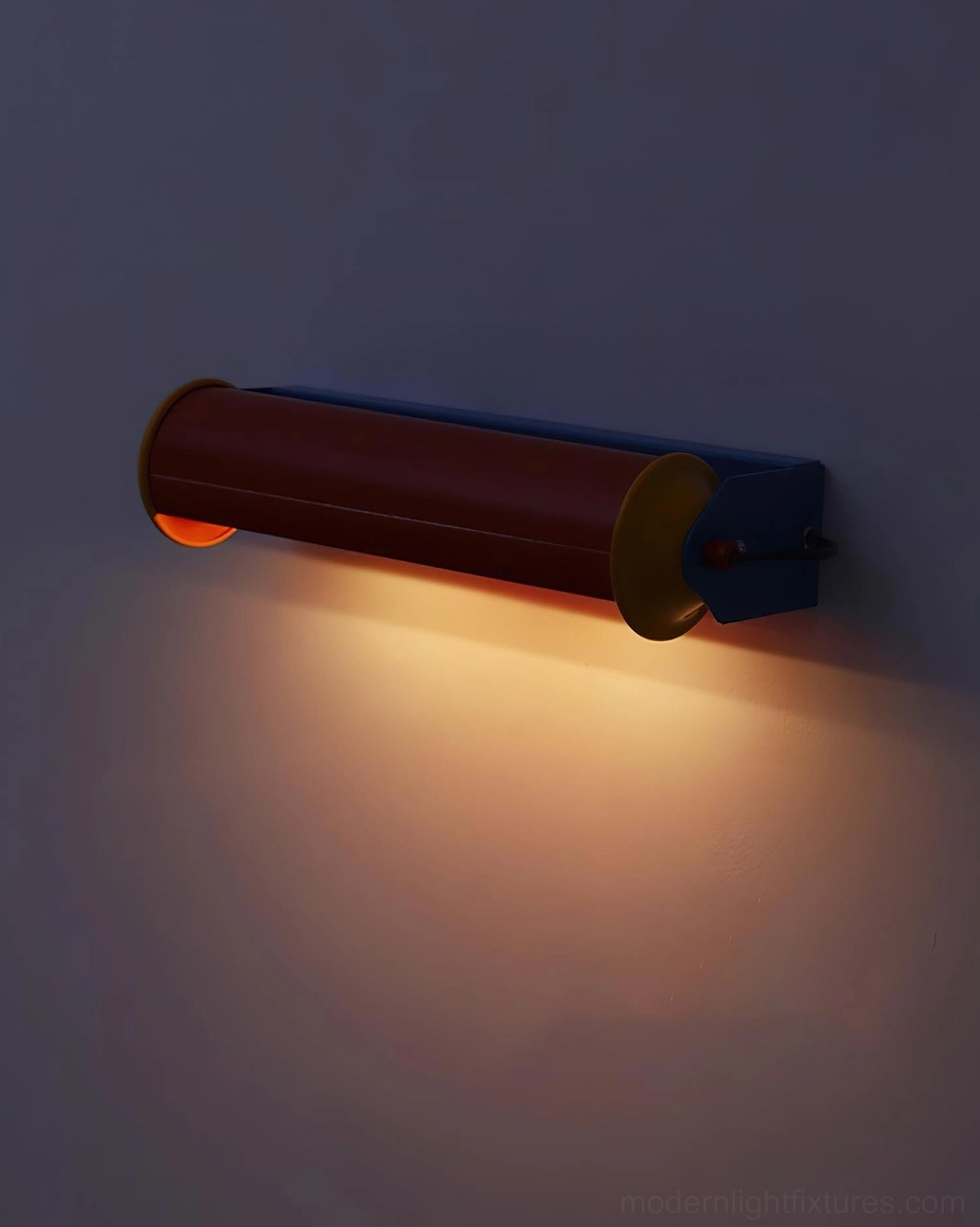 Installed modern wall lamp in indoor setting mounted on gray wall emitting warm downward directional lighting glow