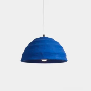 Azure dome pendant light with ribbed matte blue finish displayed in front studio view, modern handcrafted design