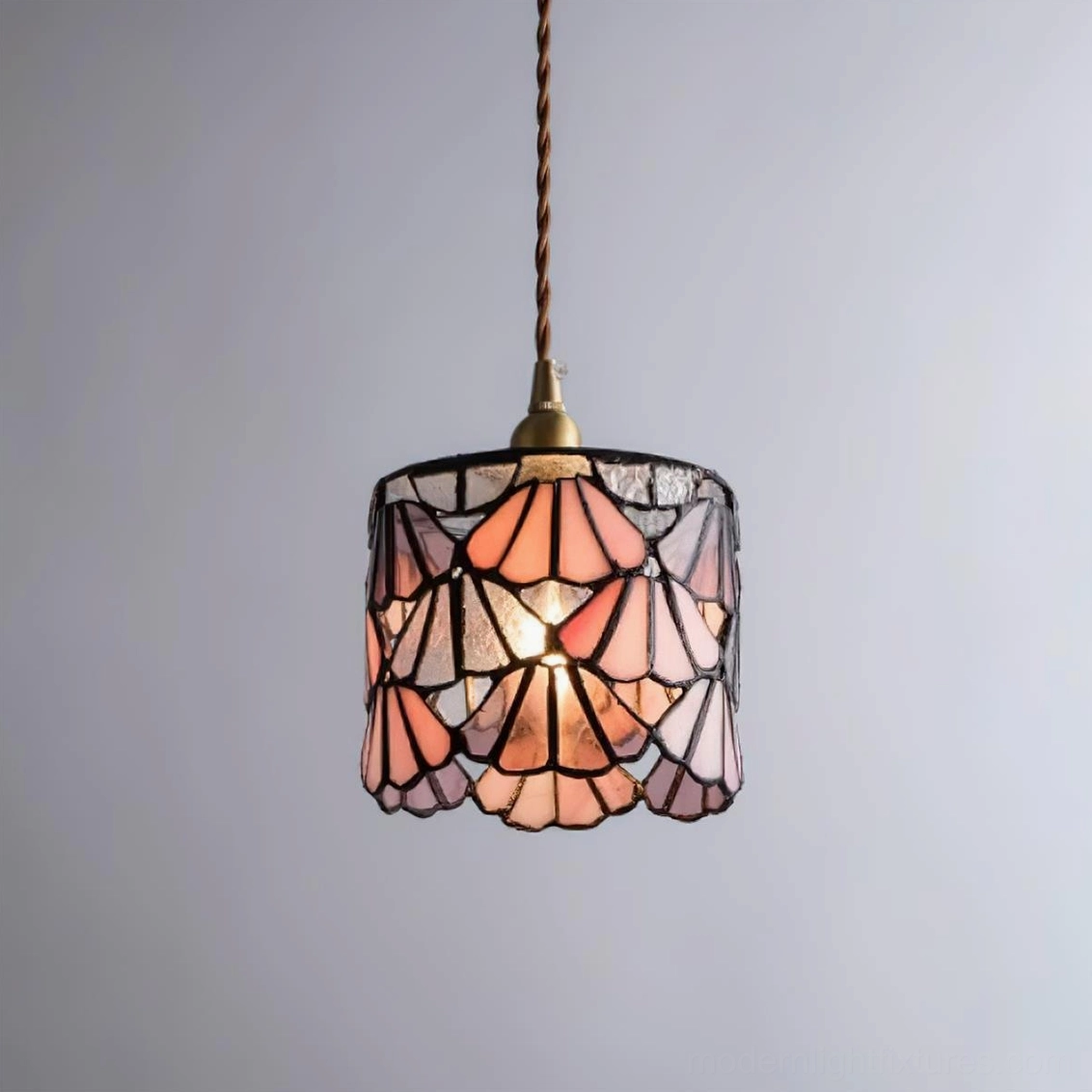 Tina stained glass pendant in modern bedroom setting creating ambient colored light