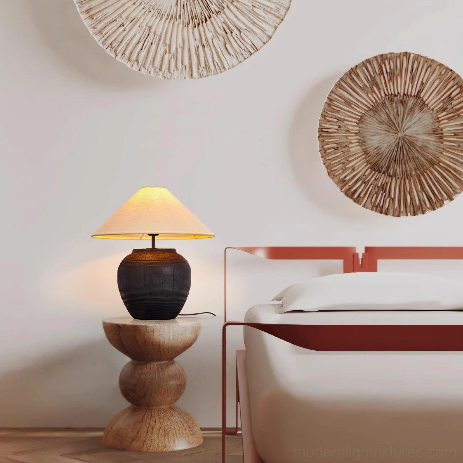 Black textured resin table lamp on wooden side table in modern bedroom