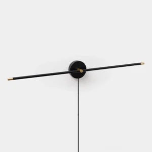 Black matte linear wall sconce with side view showing minimalist disc design and warm LED glow