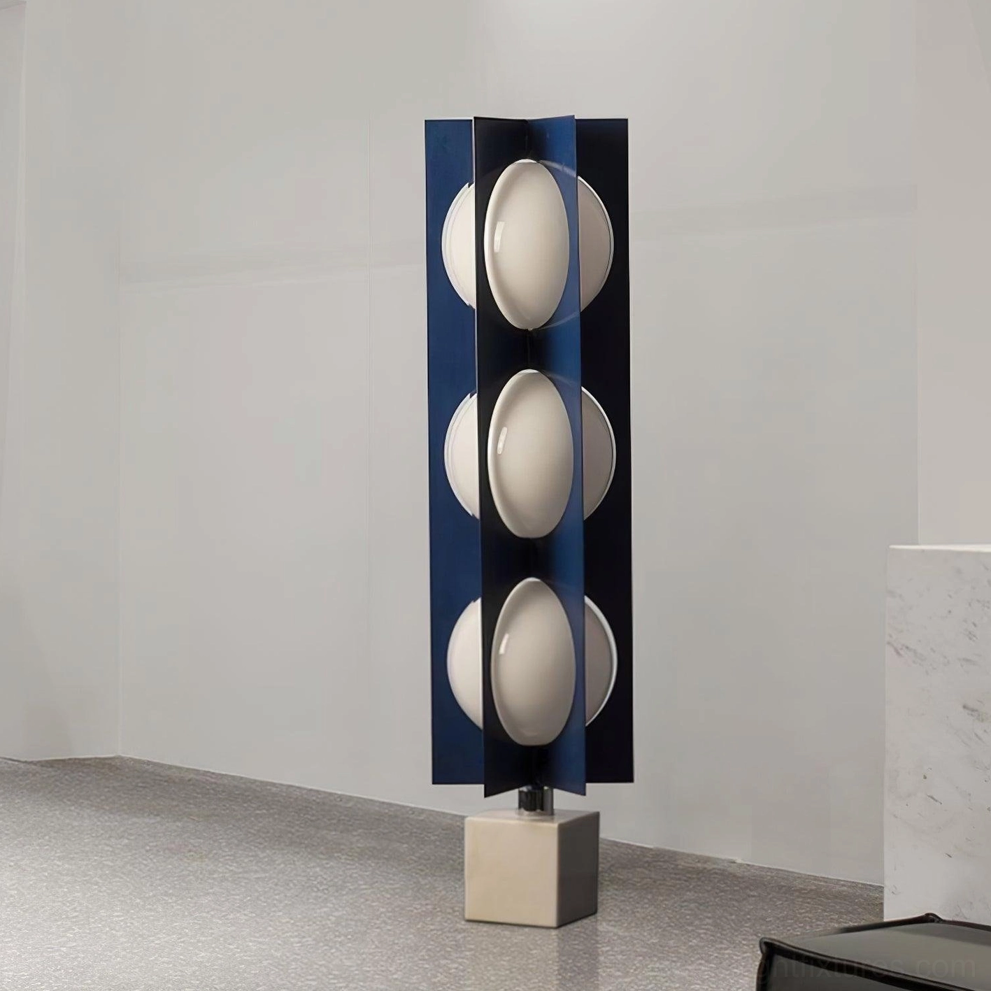 Blue floor lamp three-quarter view minimal concrete interior unlit sphere design