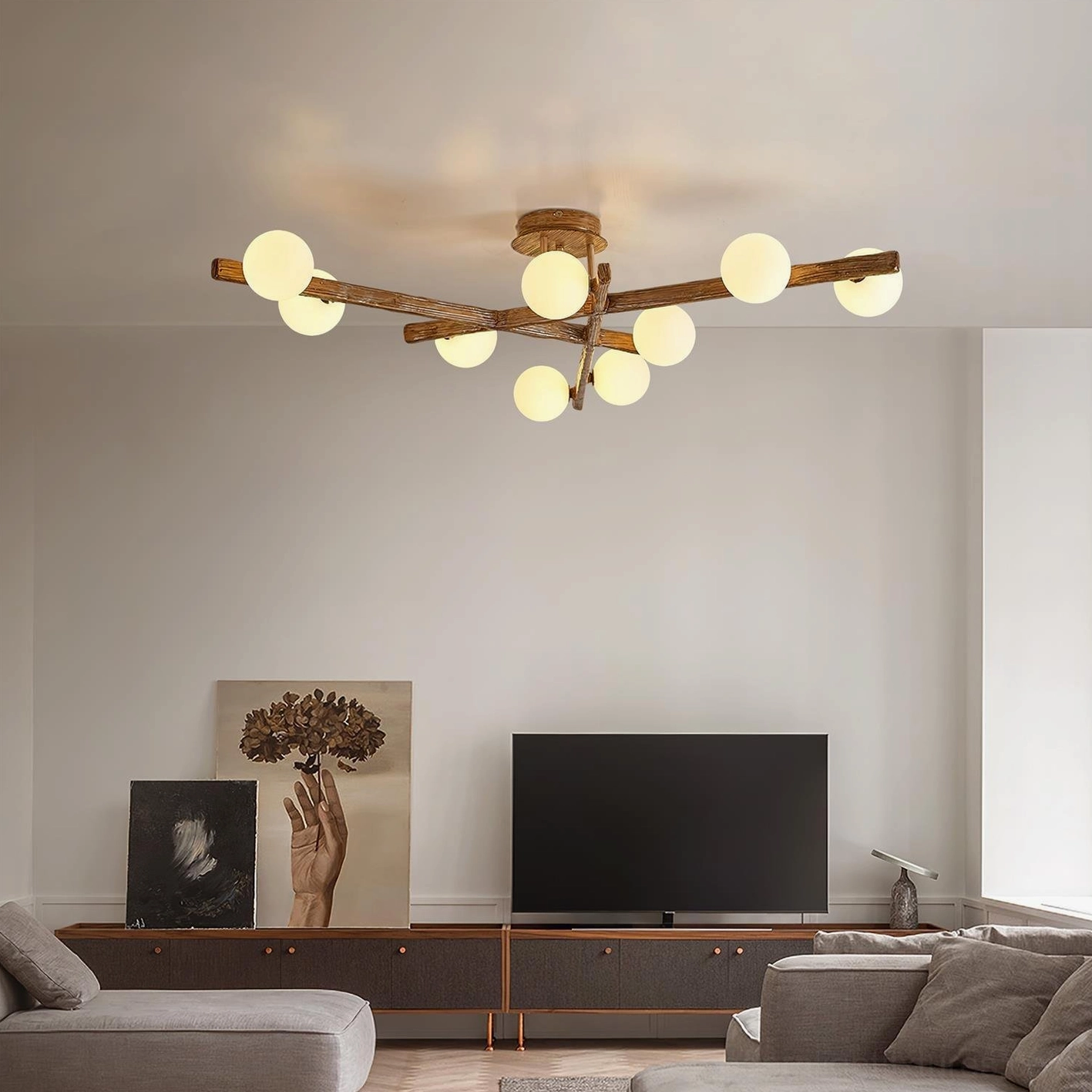 Modern branch ceiling light in living room with TV console - warm rustic wood finish lighting