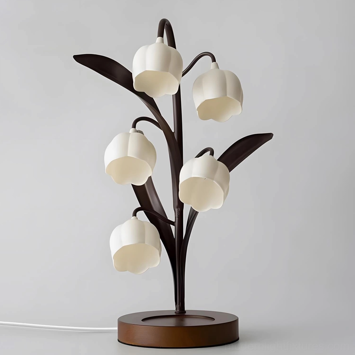 Selora sculptural table lamp front view with detailed frosted glass flower shades and power cable