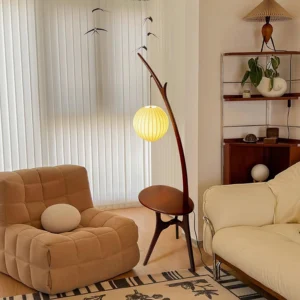Modern wooden branch floor lamp with side table in contemporary living room, curved pole design with warm ambient lighting