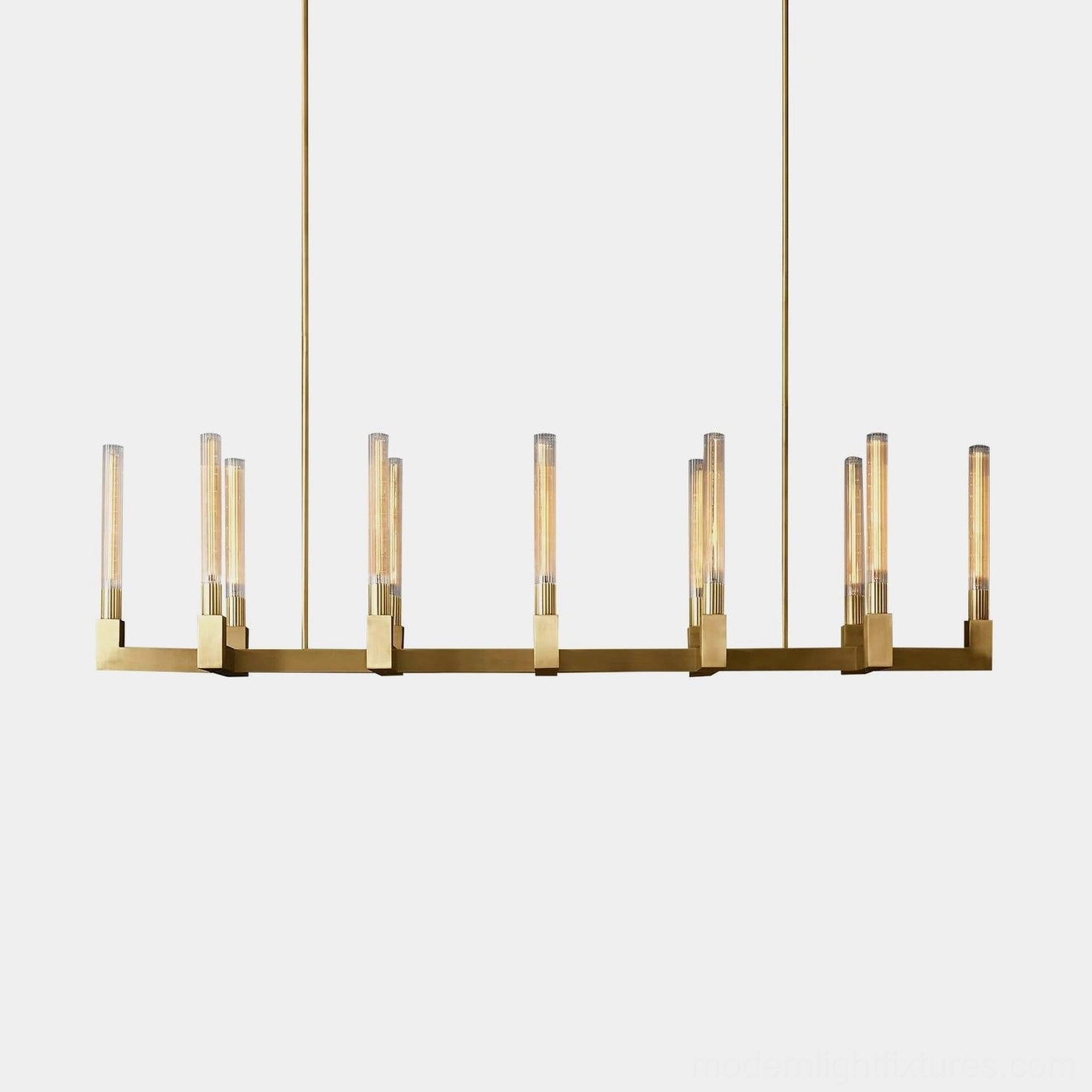 Modern linear brass glass chandelier front view studio display with clear ribbed glass shades