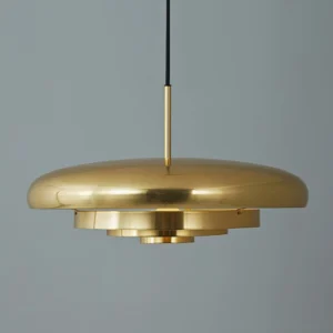 Modern layered brass tiered pendant lamp showing multi-layered metal shade and exposed inner light source