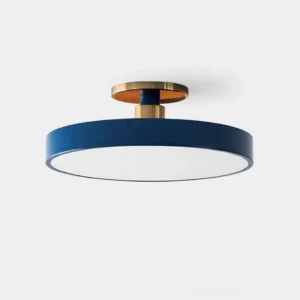 Modern brass plate flush mount ceiling light in navy blue with gold hardware, overhead studio view
