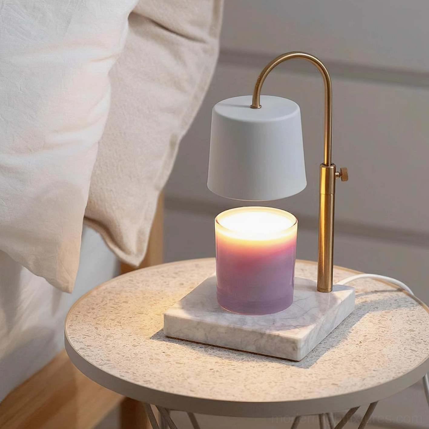 Contemporary candle warmer lamp with adjustable brass gold arm fabric shade on terrazzo base