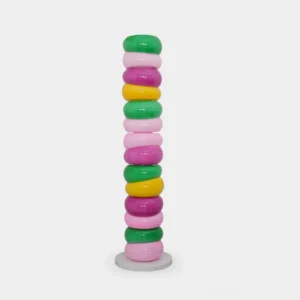 Colorful stacked glass ring floor lamp with pastel multi-colored rings and white base, front studio view