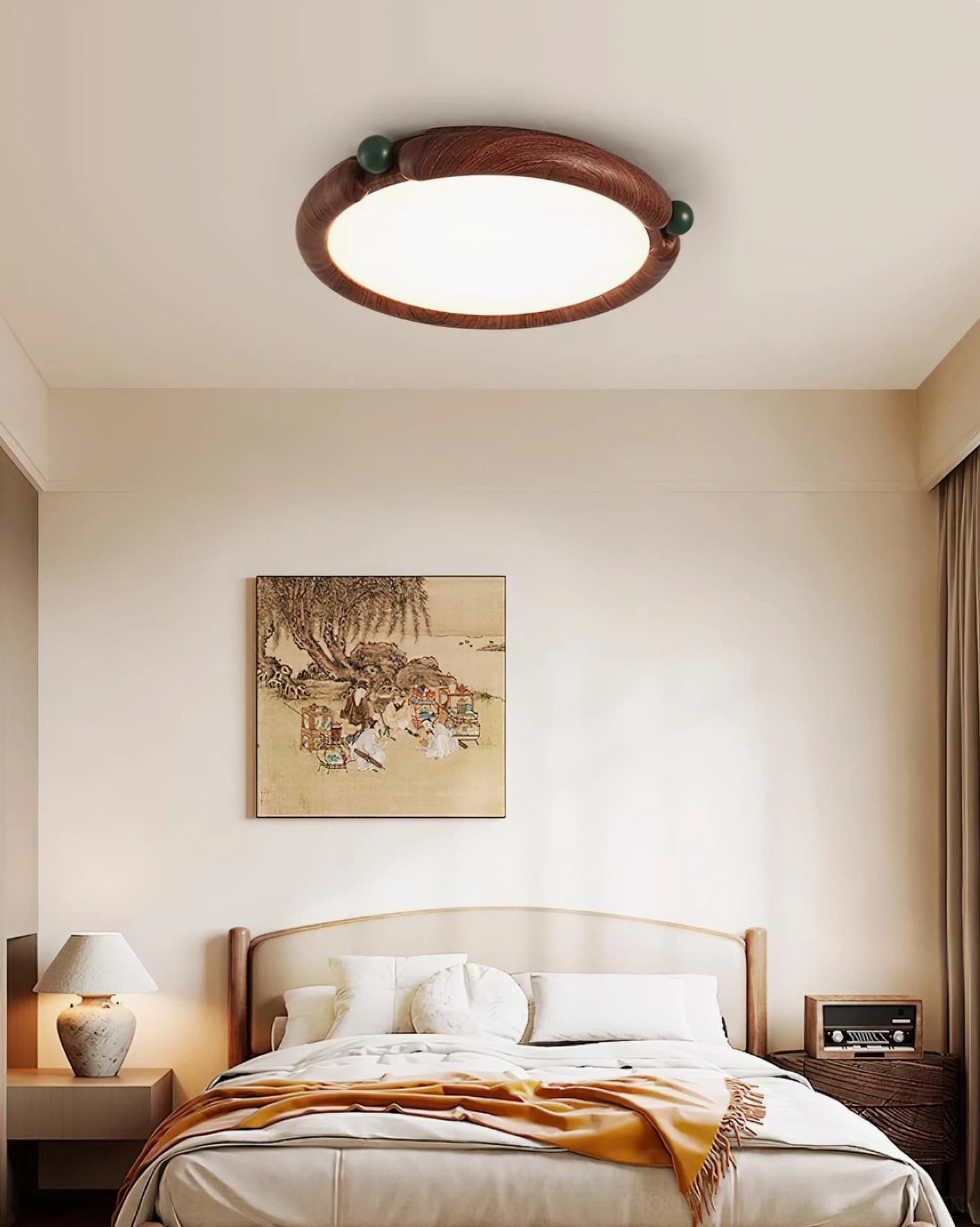 Contemporary round ceiling light installed on cozy bedroom ceiling with warm earth-toned home decor