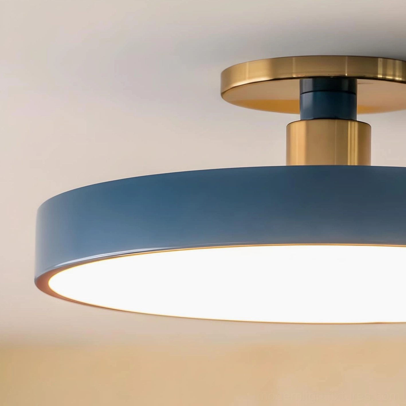 Modern ceiling light fixture close-up showing navy blue frame and illuminated diffuser panel