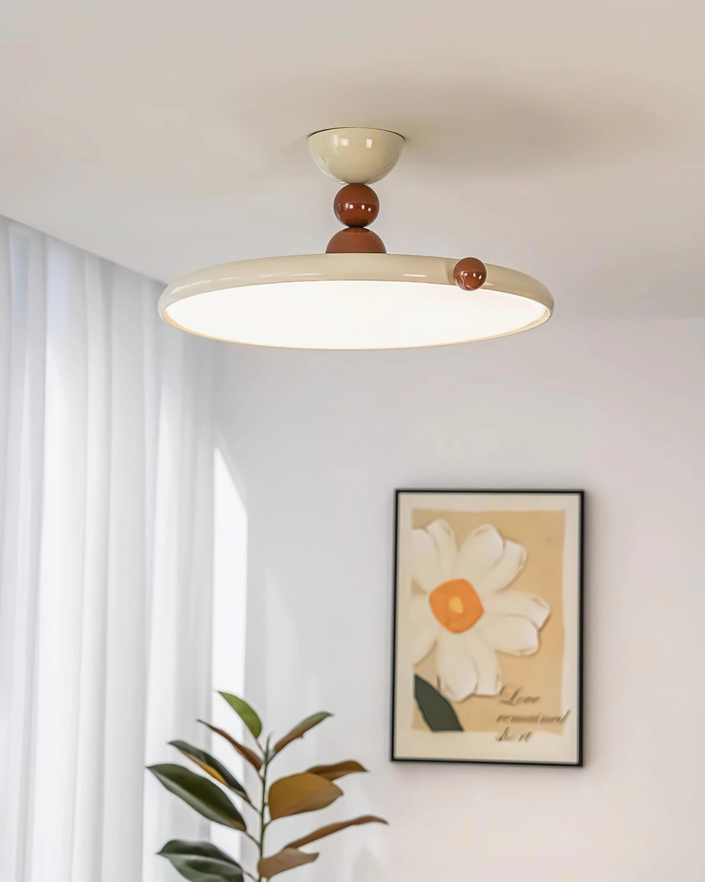 Low-angle ceiling view of modern flush-mount light fixture installed in bright minimalist residential room with neutral decor