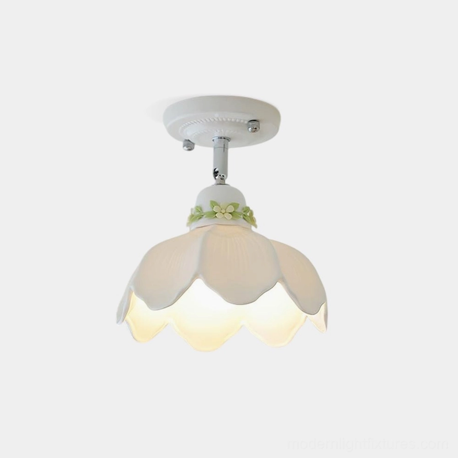 Modern ceramic ceiling lamp with floral cutout pattern and scalloped shade design, front view studio shot