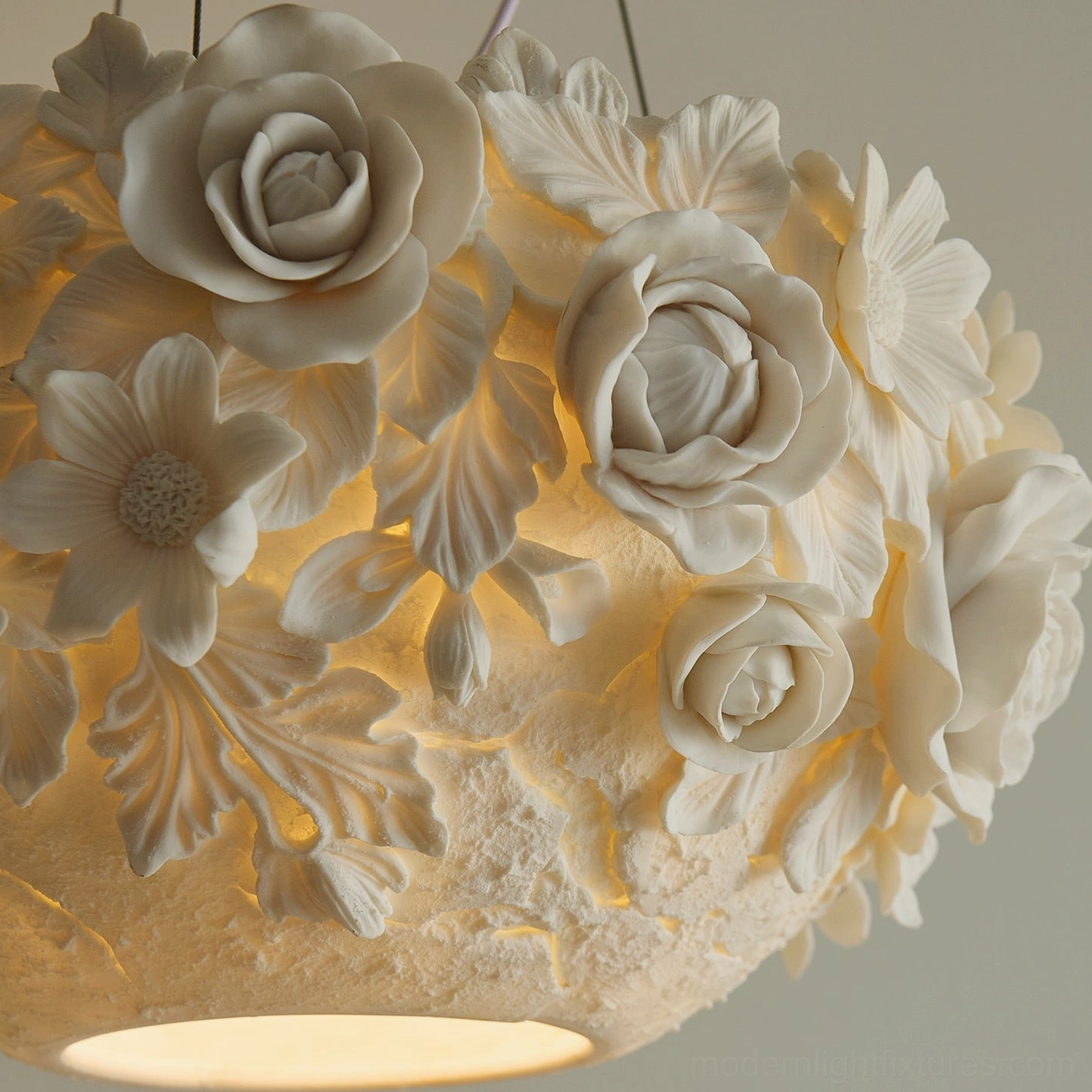 Modern ceramic flower pendant lamp with artistic petal arrangement, creating elegant botanical ambiance in interior space