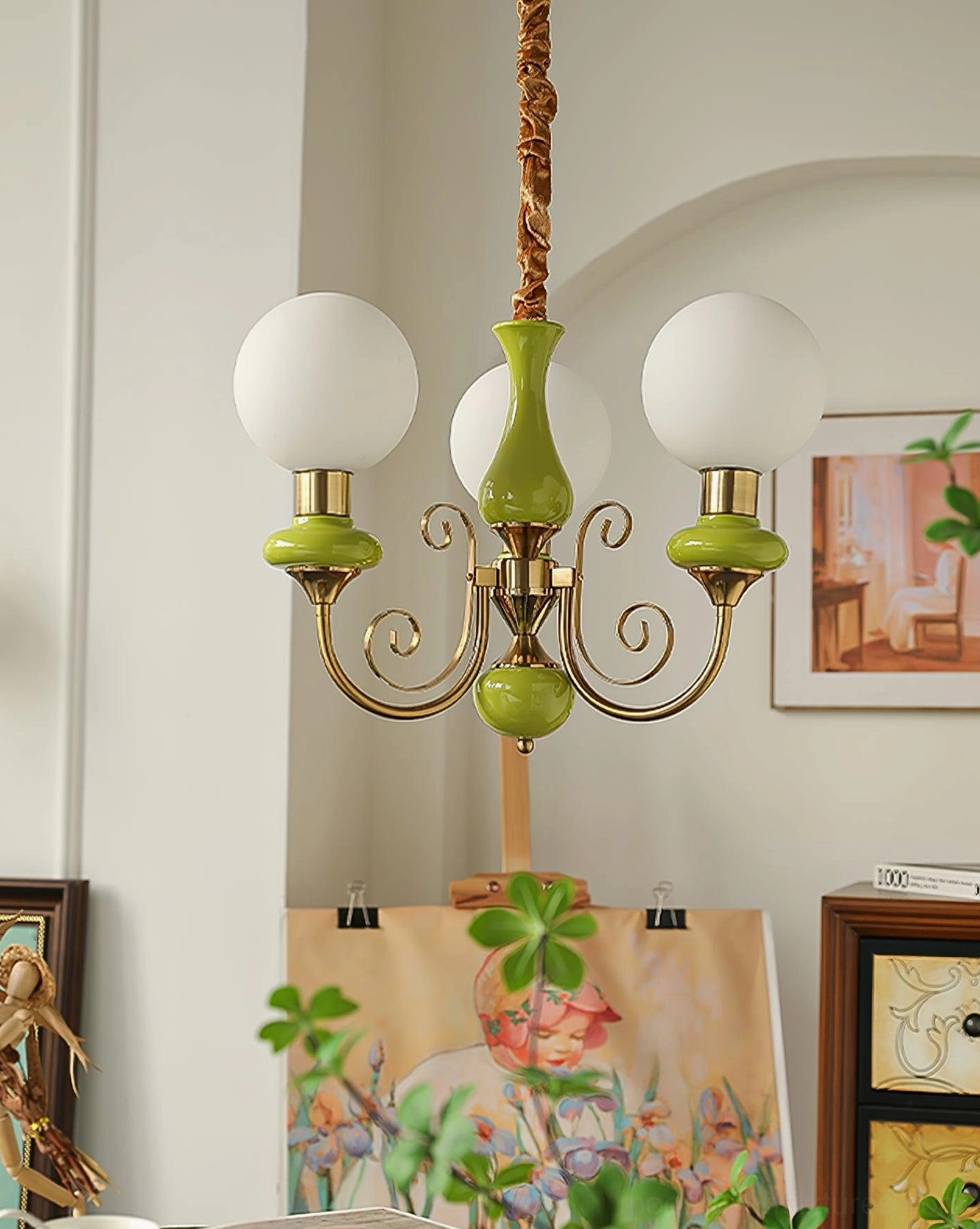 Modern chandelier fixture with ceramic base accents and frosted glass globe shades