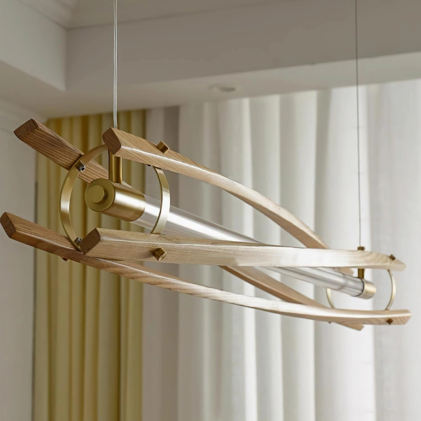 Close-up detail of geometric wood slats, brass hardware, and integrated LED tube of modern chandelier