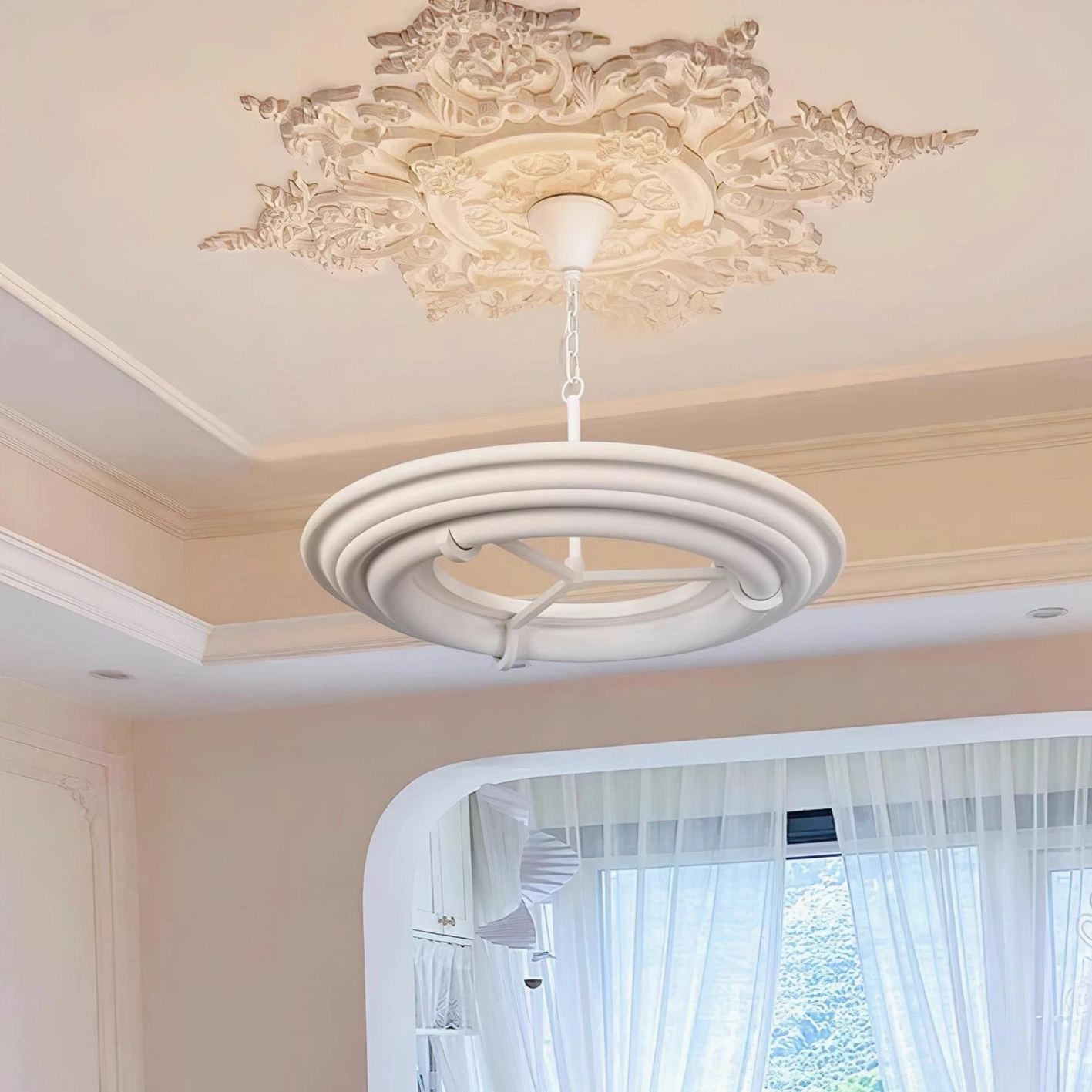 White plaster ring pendant light in French-inspired room with arched window and warm decor