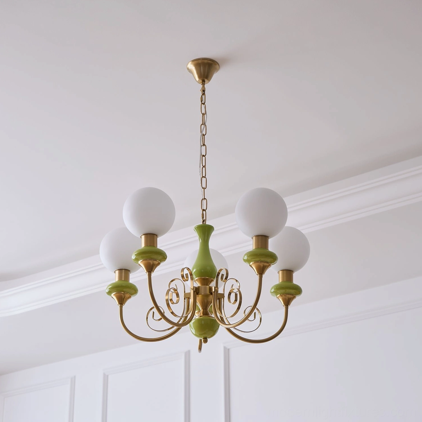 Modern chandelier with gold swirling arms and spherical glass shades detail view
