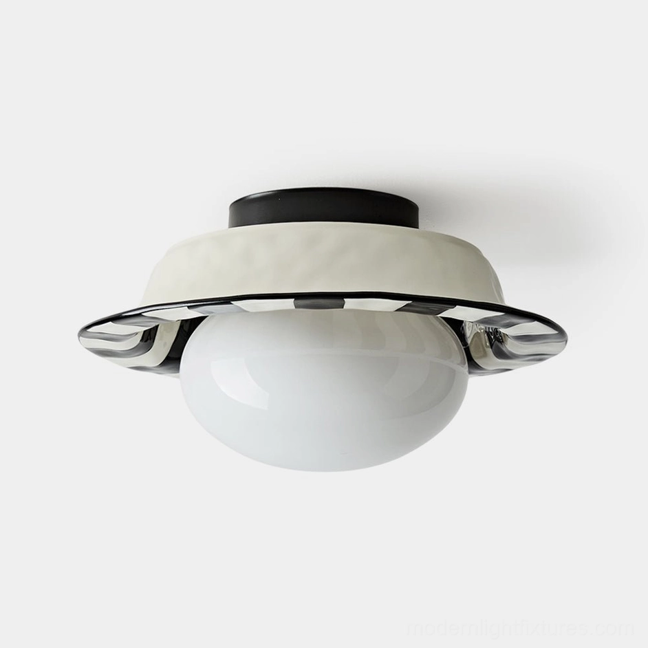 Modern checker ceiling light fixture with frosted spherical glass diffuser and metallic trim, front view on white background