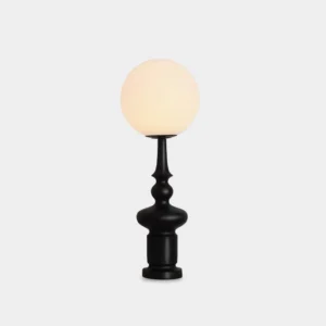 Modern chess table lamp with white globe shade and resin base on studio white background