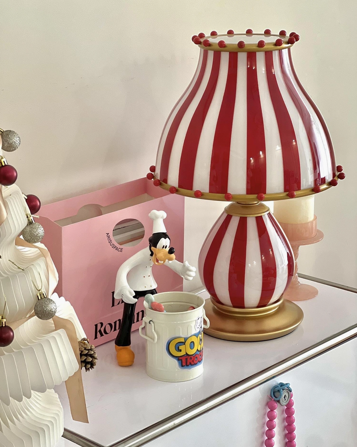 Modern circus table lamp with bold stripes and sophisticated gold finishing